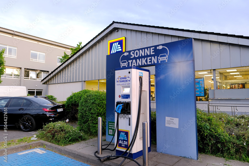 FRANKFURT, Germany May 2022 supermarket aldi, light electric cars replenish battery at