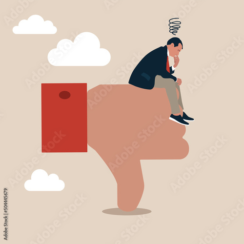 Sad stressed businessman sit on negative thumb down symbol. Demotivation from failure, mistake or negative feedback, no passion or burnout from exhausted work, mental breakdown or depression concept.