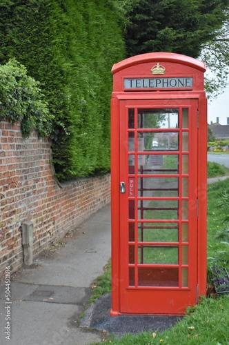 Red phone box in a village