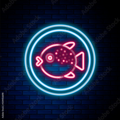 Glowing neon line Puffer fish on a plate icon isolated on brick wall background. Fugu fish japanese puffer fish. Colorful outline concept. Vector