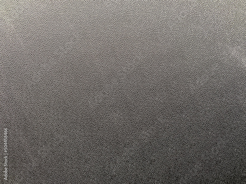 Photo of the texture of black polycarbonate.The background is made of dark plastic. The plastic material is black. photo