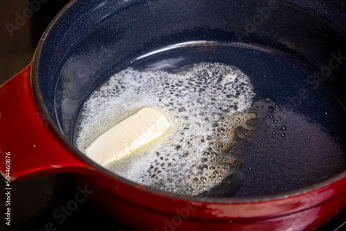 in a saucepan on the stove melt butter for the preparation of bechamel sauce and other dishes.