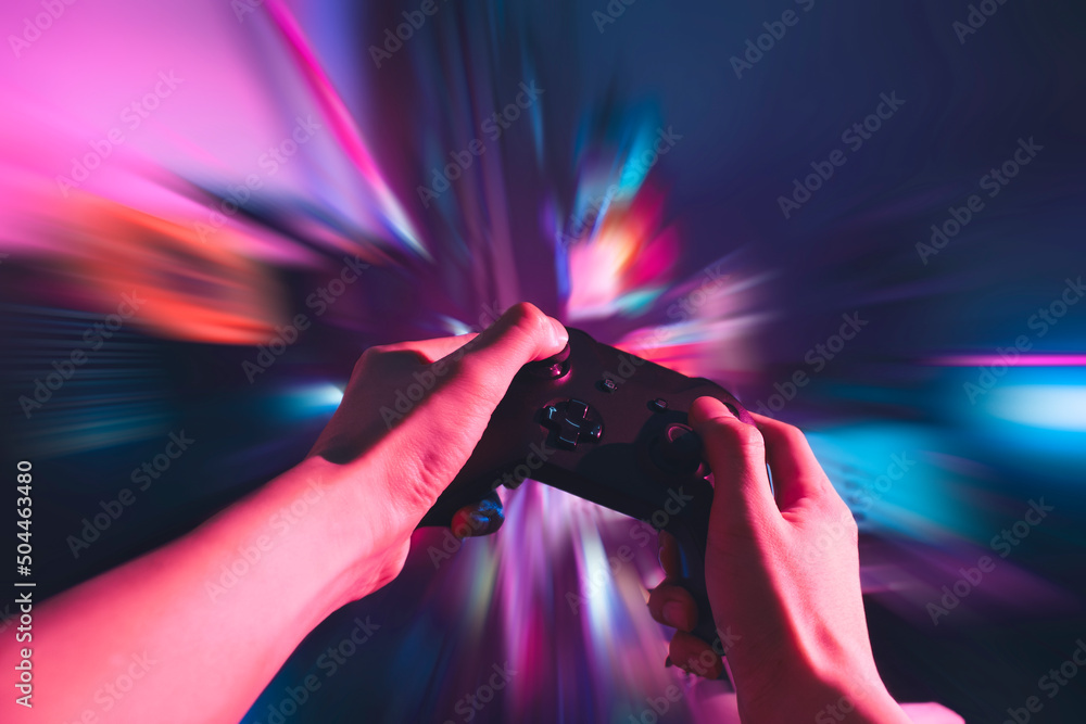 gamer playing the online game with joystick controller in neon glow dark cyberpunk room, gaming and e-sports challenge tournament streaming, streamer with analog device in living house - obrazy, fototapety, plakaty 