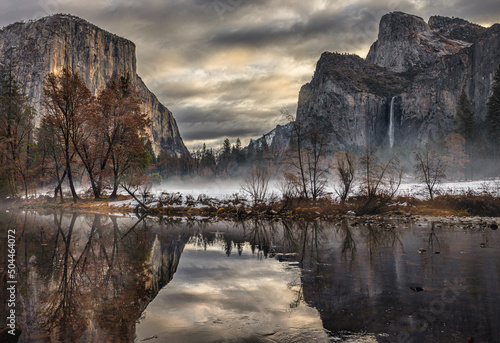 Yosemite in moody, cold weather under dark clouds with stream in foreground © Alton Marsh