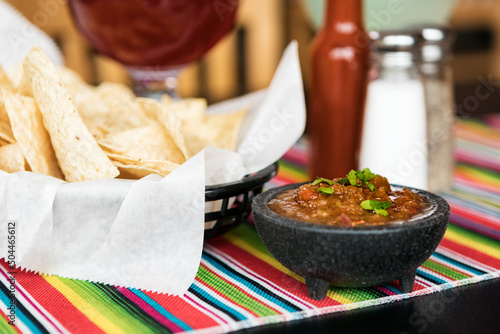 Cinco: Freshly Made Chips And Salsa On Table photo