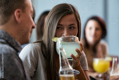Cinco: Group Of Friends At Bar Drinking Beer And Margaritas photo