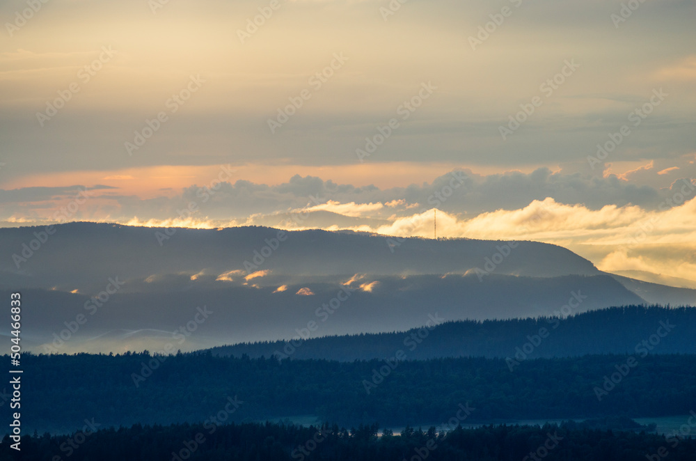 Southern Urals, Ural Mountains in summer. Sunset in the mountains. The top of a mountain ridge.