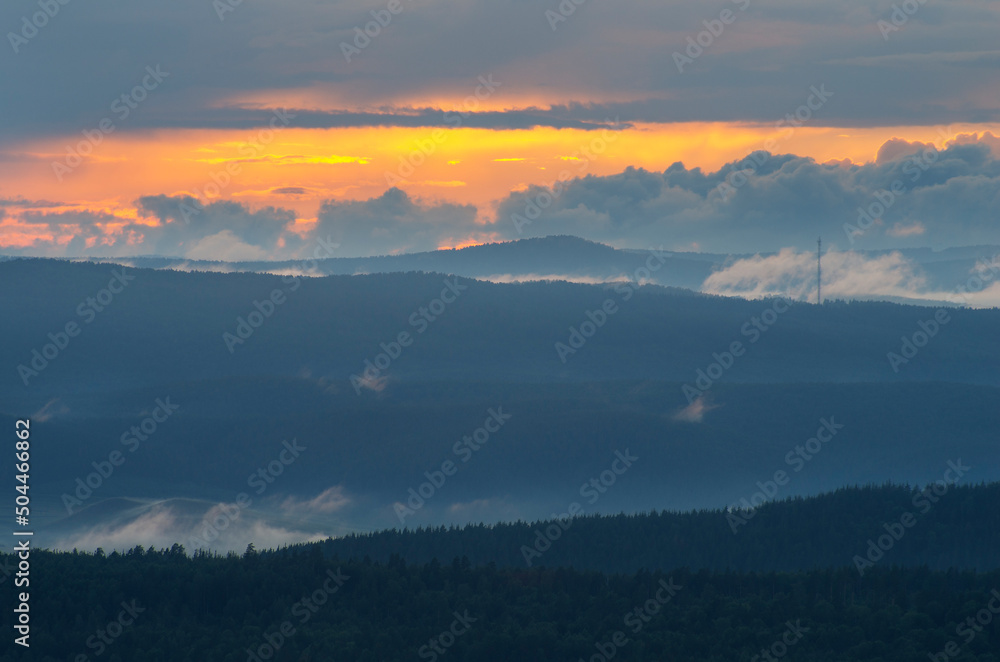 Southern Urals, Ural Mountains in summer. Sunset in the mountains. The top of a mountain ridge. Southern Urals, Ural Mountains in summer. Sunset in the mountains. The top of a mountain ridge.