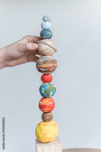 space planet stacking toy with hand  photo