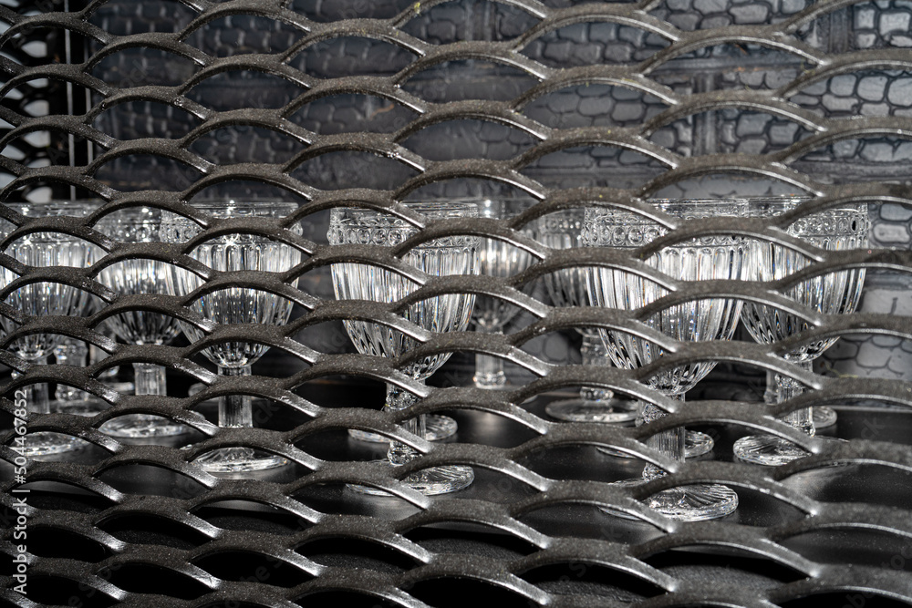 Metal cabinet for wine glasses. Cabinet made of corrugated pressed metal Metal cabinet for wine glasses. Cabinet made of corrugated pressed metal
