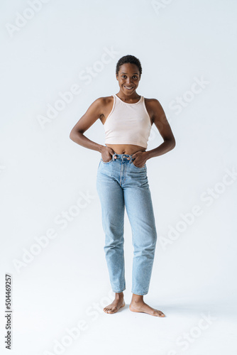 happy young black woman in studio