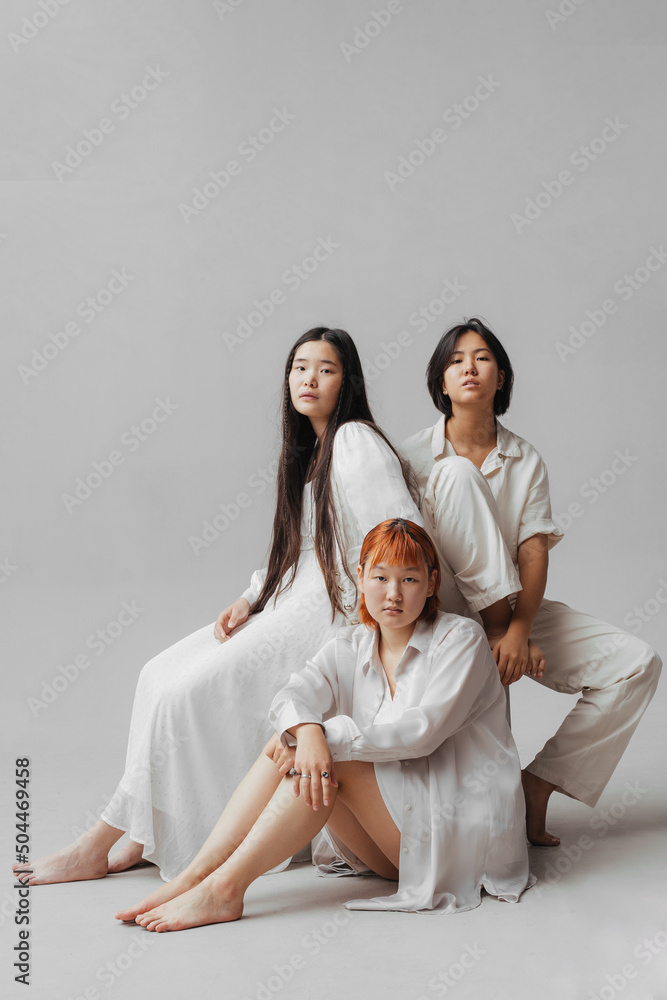 © Ivan Ozerov/Stocksy - group of asian girlfriends in studio