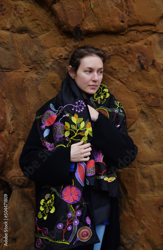 a beautiful woman by the red reck