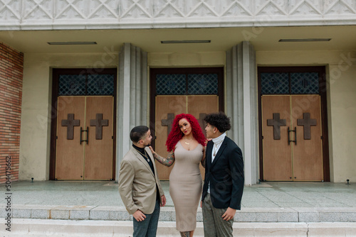Modern mom with sons on church steps