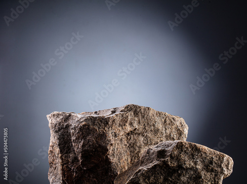 Natural stone background podium on gray background

