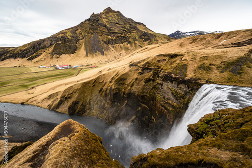 Panoramic view of the famous Skógafoss waterfall and the nearby Drangshlíðarfjall mountain, Laugavegur hiking trail, Iceland