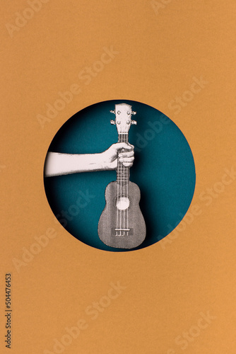 hand holding a guitar