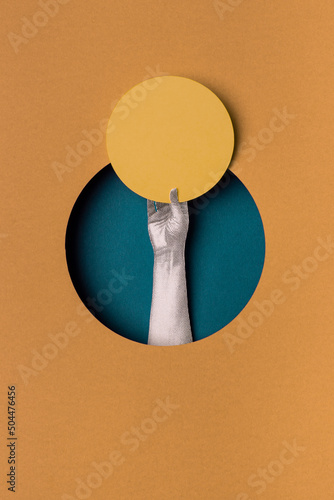 Hand holding a placard