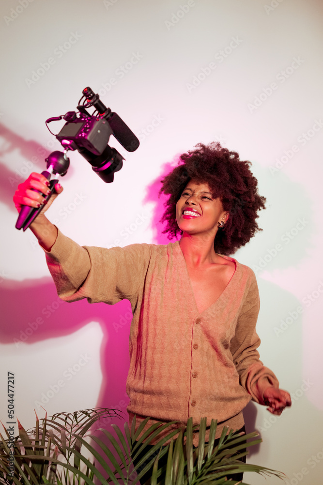 © Mauro Grigollo/Stocksy - Happy female freelancer making a video
