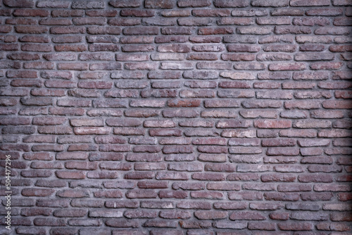 Background wall of red bricks. Wallpaper  texture of shabby bricks.