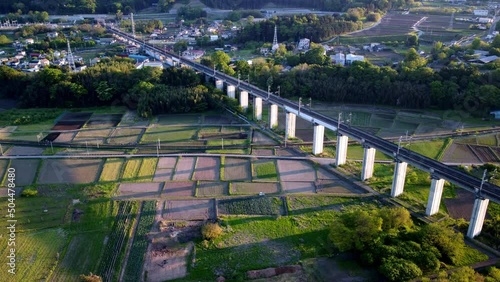 Farm in countryside with Shinkansen bridge in Japan, Aerial View Timelapse photo