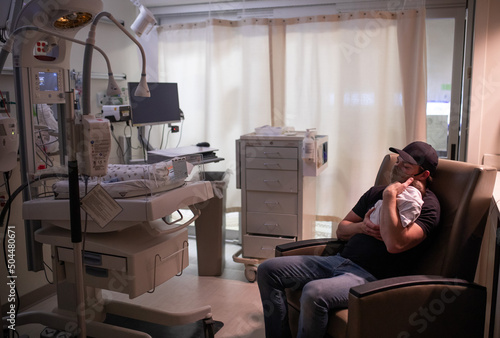 Father and infant in NICU photo