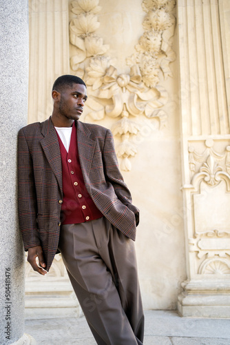 Portrait Of A Handsome And Stylish Black Man On A Neoclassic Building. photo