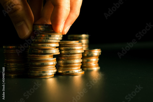 Pile of gold coins stack in finance treasury deposit bank account for saving . Concept of corporate business economy and financial growth by investment in valuable asset to gain cash revenue profit . photo