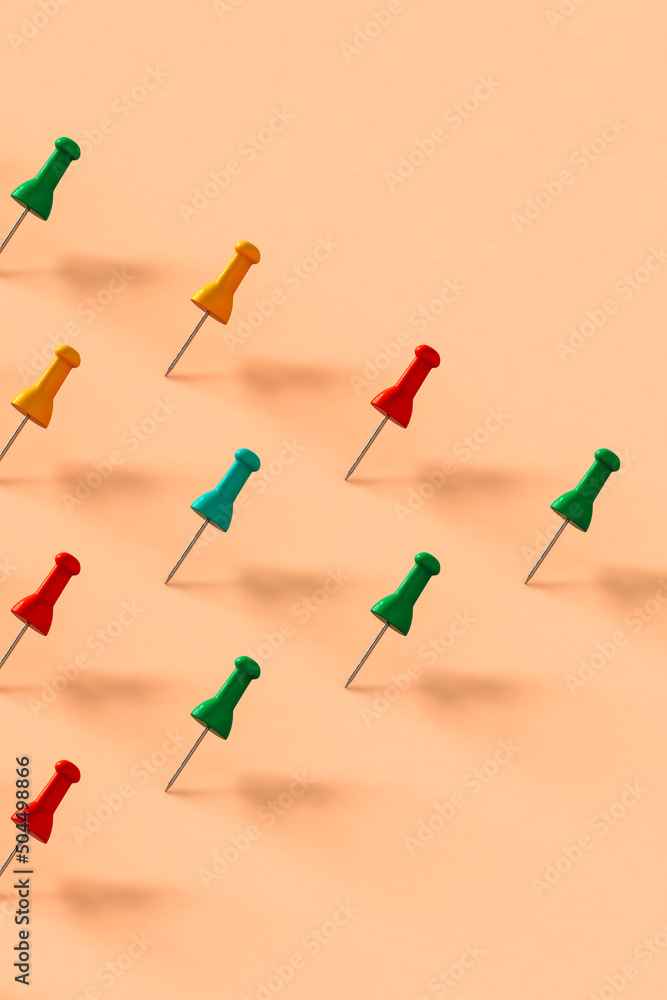 collection of colorful push pins on pink background collection of colorful push pins on pink background