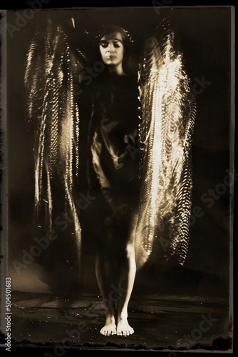 Abstract woman in golden sparkle photo