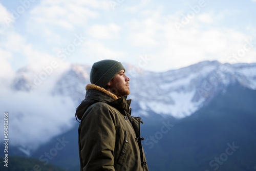 Portrait of happy meditative man in the mountain