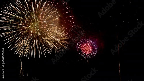 Colorful Firework Displays lighting up the sky at night photo