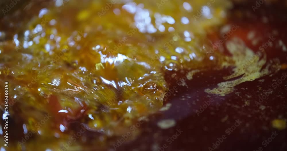 extreme close up of boiling spicy soup in Chinese hotpot. slow motion extreme close up of boiling spicy soup in Chinese hotpot. slow motion