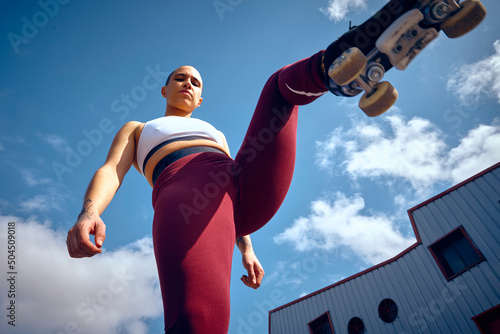 Low angle view of a roller skater non binary person
