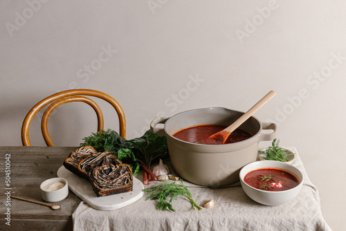 Ukranian babka and borscht on dining table photo