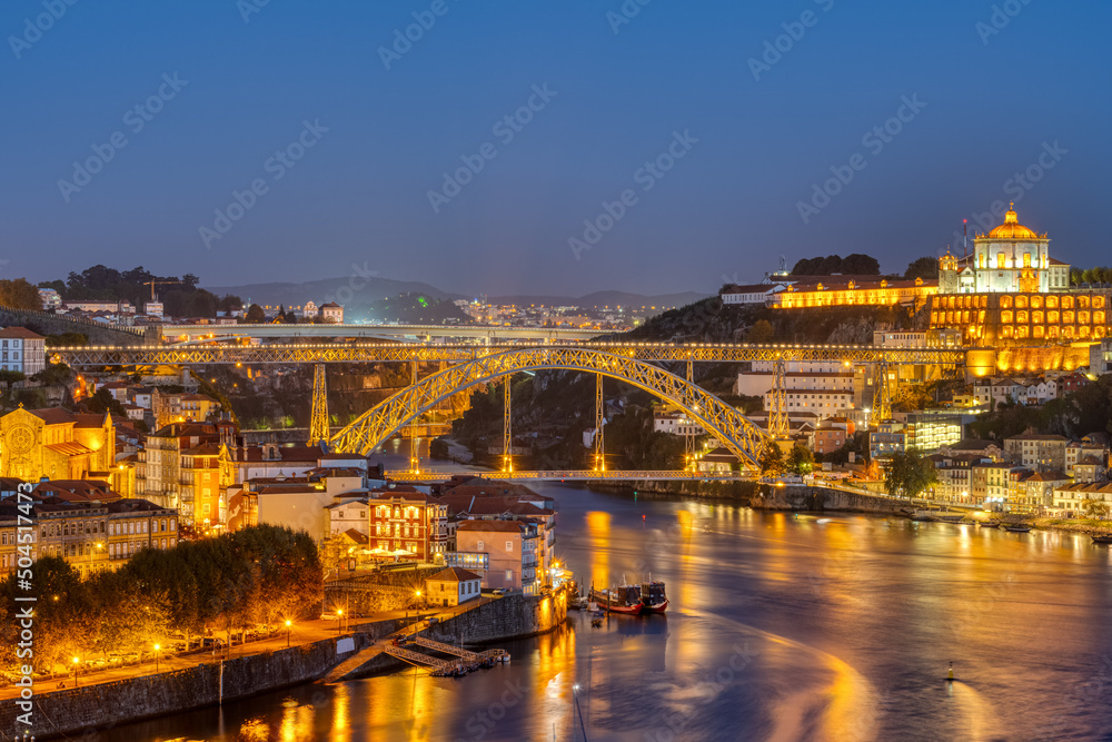 The river Douro and the famous iron bridge in Porto at night
