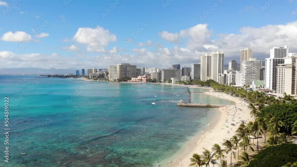 Flying over the ocean along the coastline in Waikiki on Oahu, Hawaii Flying over the ocean along the coastline in Waikiki on Oahu, Hawaii