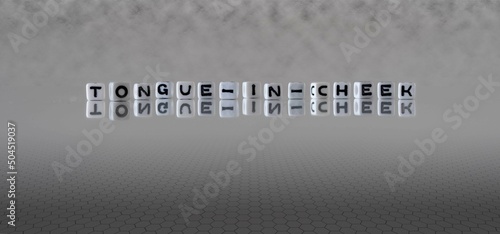 tongue in cheek word or concept represented by black and white letter cubes on a grey horizon background stretching to infinity