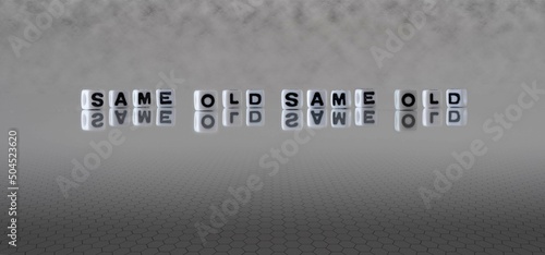 Canvas Print same old same old word or concept represented by black and white letter cubes on