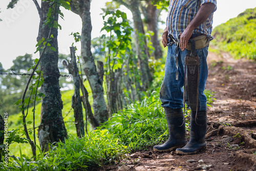 Farmer on dirt road in Costa Rica with Machete 
