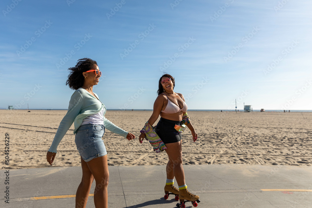 © Jayme Burrows/Stocksy - Black Sisters at the Beach