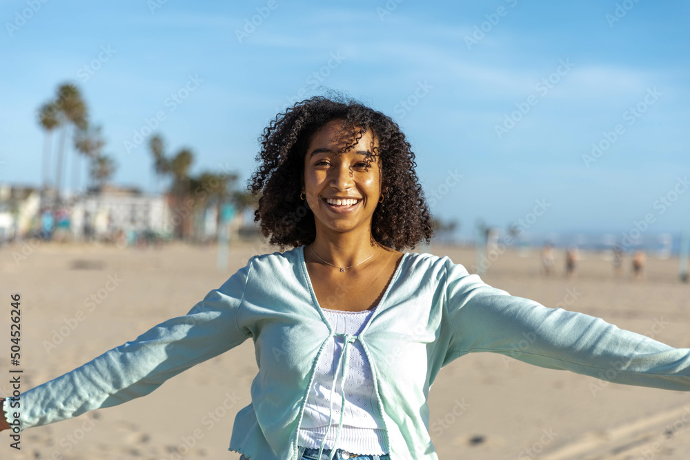 Young Woman Smiles at Beach