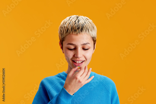 Teenager taking pill 