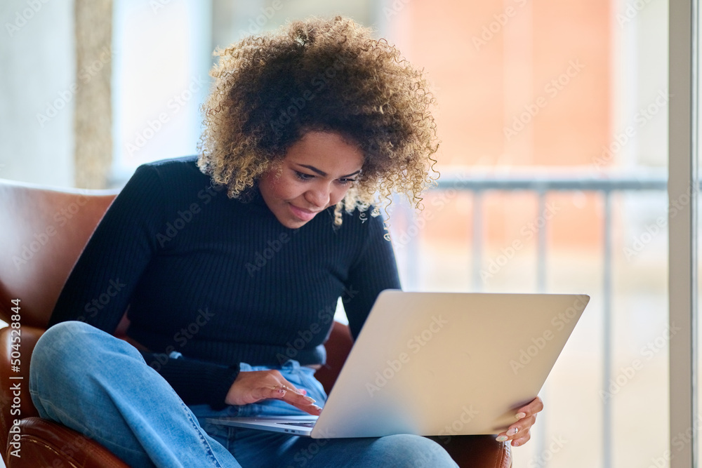Woman browsing data on laptop Woman browsing data on laptop