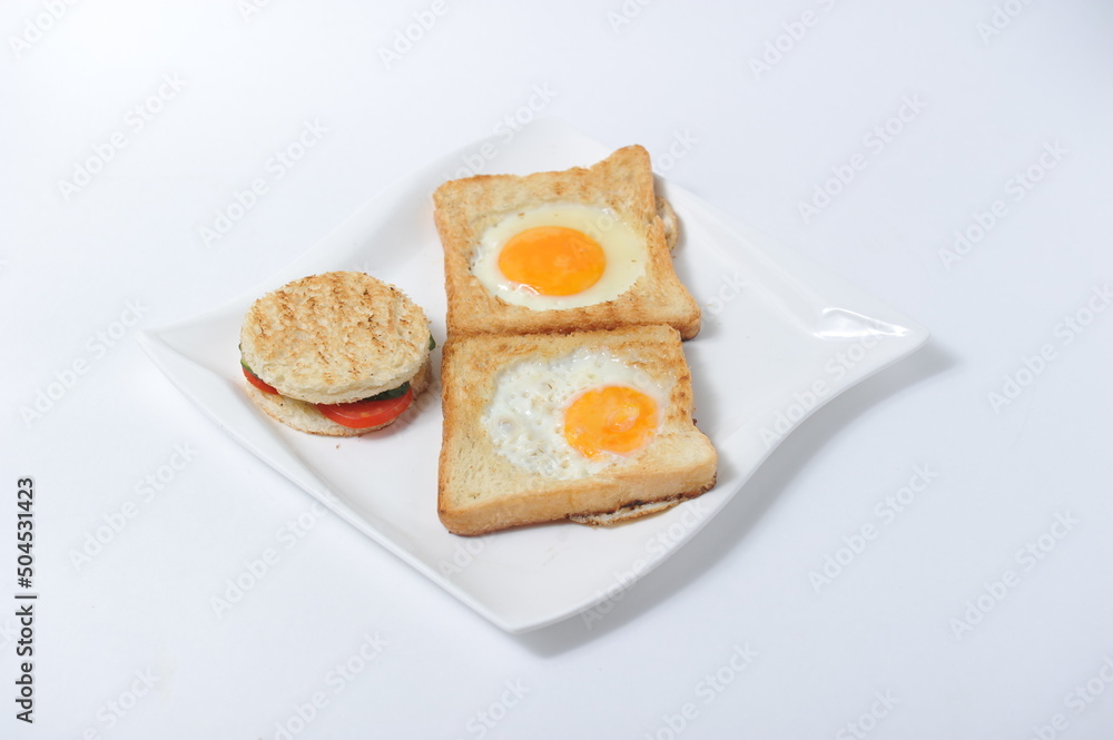 Toast with vegetables and scrambled eggs on a plate. Toast with vegetables and scrambled eggs on a plate.