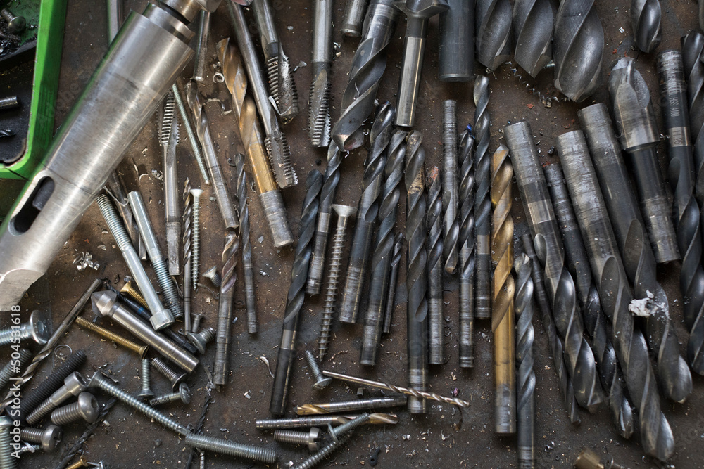drill bits with screws, nails and blacksmith tools drill bits with screws, nails and blacksmith tools