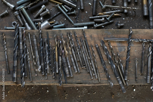 drill bits with screws, nails and blacksmith tools