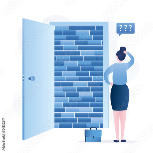 Brick wall behind an open door. Businesswoman stopped in front of difficulties. Dead end, concept. Overcoming obstacles in work and business. Gender gap, discrimination.
