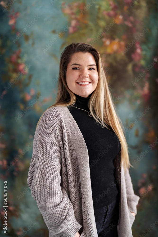 Cheerful teacher looking at camera in studio Cheerful teacher looking at camera in studio