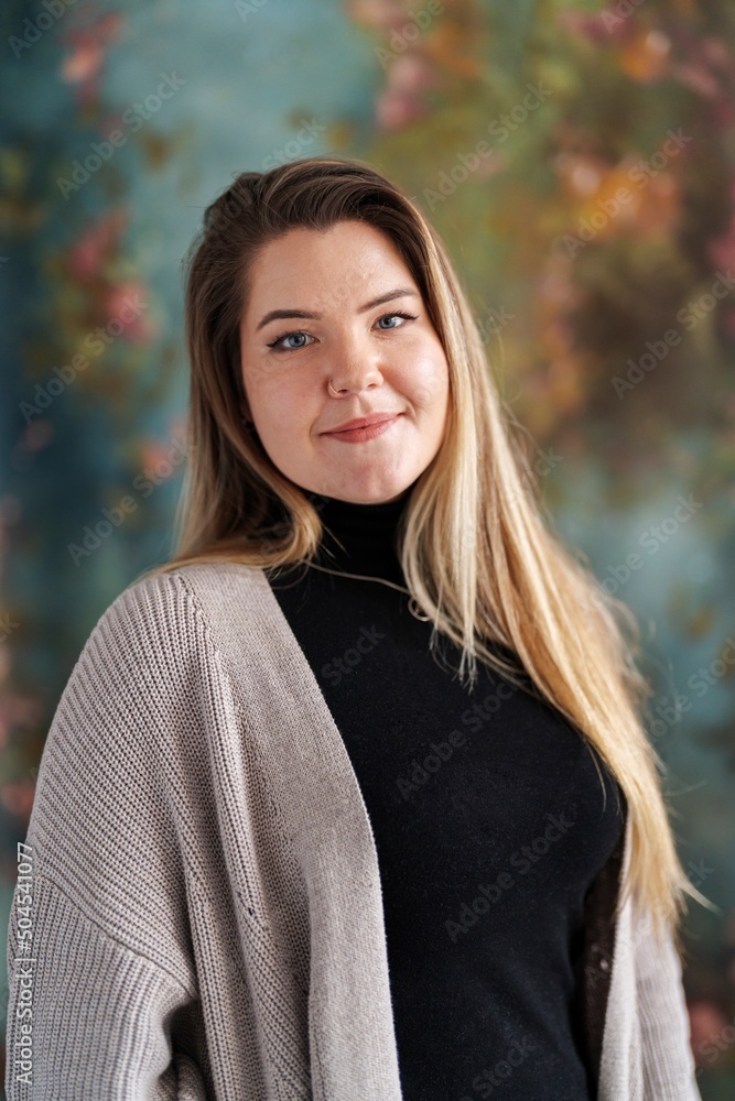 Cheerful teacher looking at camera in studio Cheerful teacher looking at camera in studio
